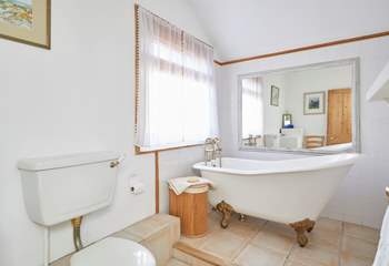 Take a long soak after a busy day in the stunning roll-top bath - please note there is a step up to the bath.