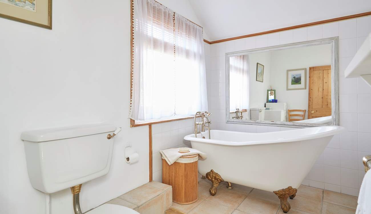 Take a long soak after a busy day in the stunning roll-top bath - please note there is a step up to the bath.