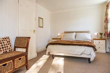 The master bedroom overlooks the garden.