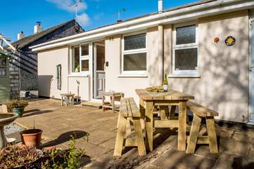 Enjoy a meal on the sunny patio overlooking the garden.