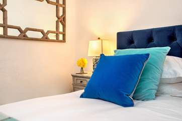 The bed is dressed to perfection.