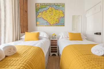 The master bedroom with king-size bed can also be configured as twin beds for flexibility.