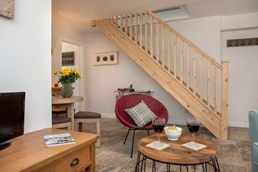 The stairs lead off from the sitting-area to the second bedroom.