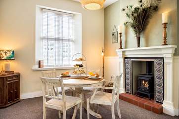 The dining-area has a toasty wood-burner making this a perfect retreat all year round.