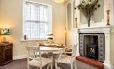 The dining-area has a toasty wood-burner making this a perfect retreat all year round. - Thumbnail Image