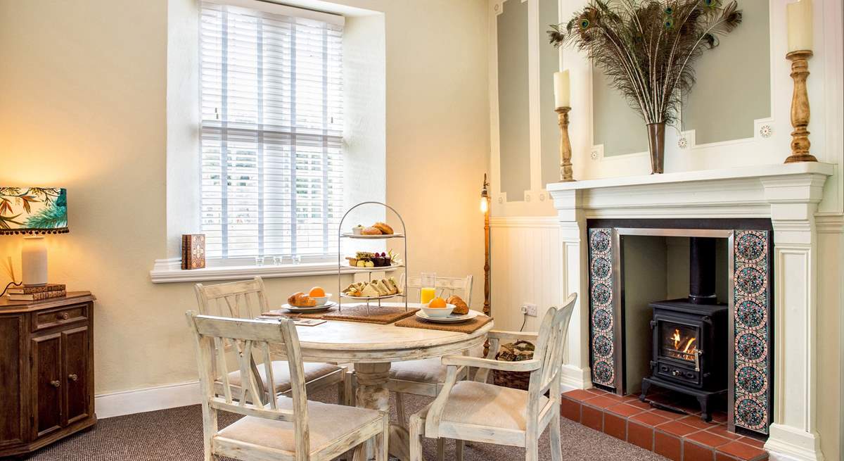 The dining-area has a toasty wood-burner making this a perfect retreat all year round.