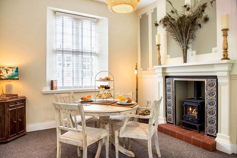 The dining-area has a toasty wood-burner making this a perfect retreat all year round.
