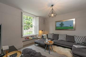 All the rooms have wooden shutters and the original sash windows bringing in loads of light