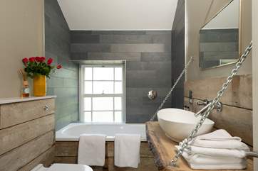 This is the unique bathroom on the second floor. It has a walk in shower too.