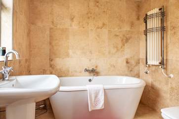 The en suite to Bedroom 2 has a lovely free-standing bath and ...