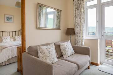The sitting-area connects nicely to the bedrooms and links directly to the outside decking area.