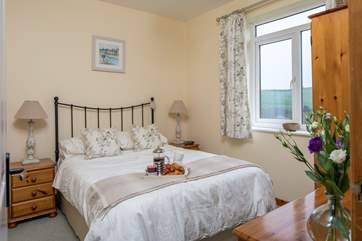 The master bedroom is a delightful place to relax after a full day of adventure.