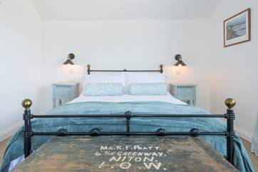 Pastel hues welcome you to the upstairs double bedroom.
