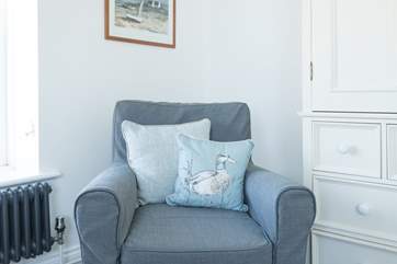 Curl up and relax with a good book and look out of the window over the pool.
