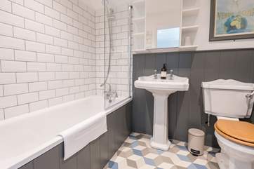 The family bathroom on the first floor with bath and shower over.