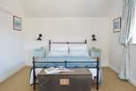 The lovely hues of blue give double bedroom one on the first floor a tranquil feel.