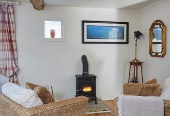 The lovely corner of the living-room with a small but efficient wood-burner effect electric stove that will keep you warm and cosy in the cooler months.