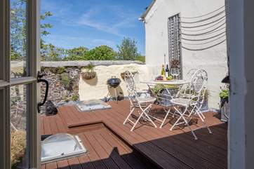 Dining al fresco is a must on this beautiful rooftop patio.