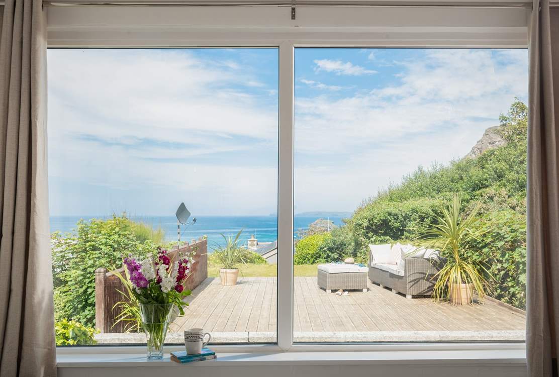 Patio doors lead out from the sitting-room onto the terrace.