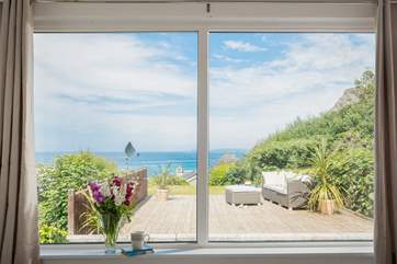 Patio doors lead out from the sitting-room onto the terrace.