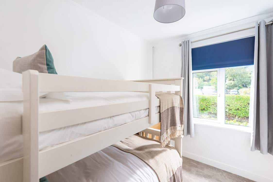 Bunk bedroom number 3 is bright and airy.