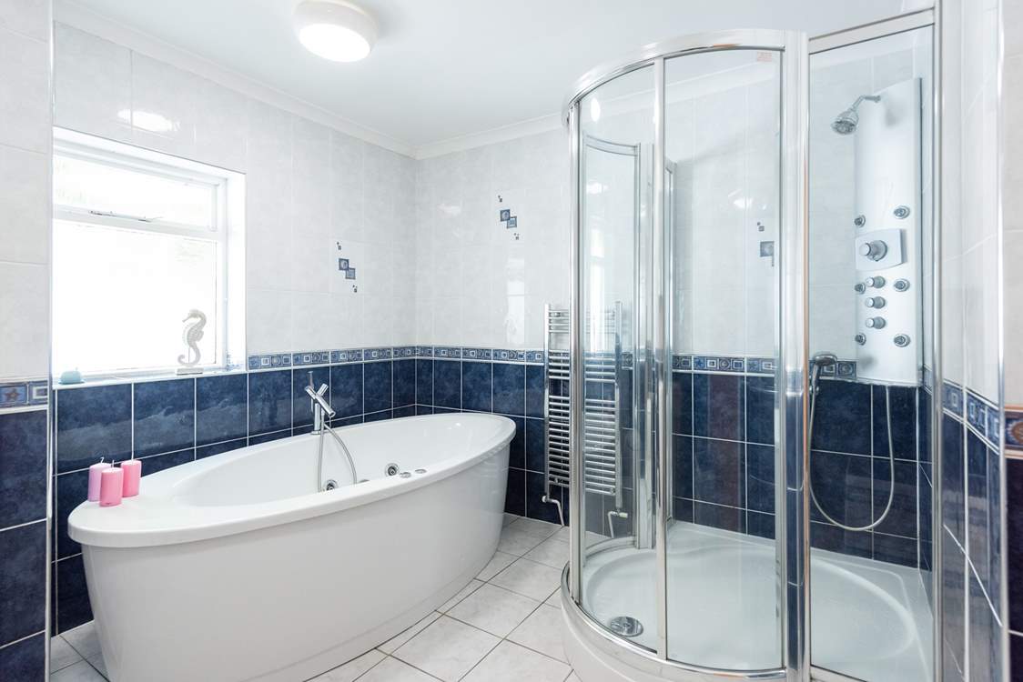 The modern family bathroom has a fabulous free-standing bath! Big enough for two.