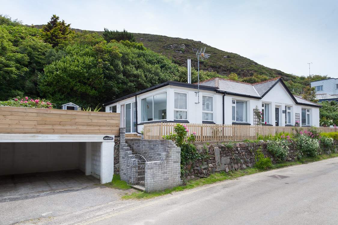 Goofyfoot enjoys an elevated position. There is a car parking space to the right of the property, and two additional spaces (for small to medium-sized cars) located in the undercover carport below.