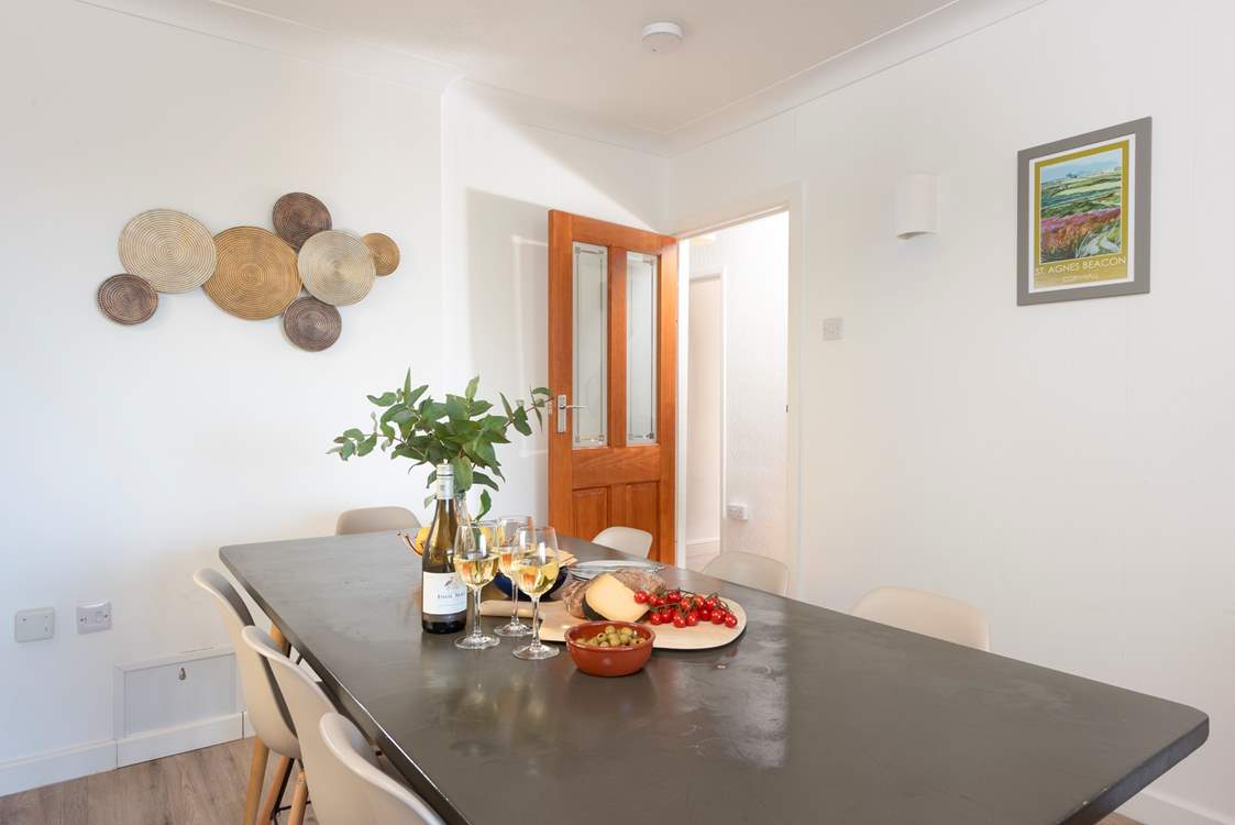 There is plenty of room for eight guests around the dining table.