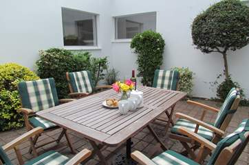 Dining al fresco in this superb internal courtyard is delightful, especially as you can still enjoy the waterside views.