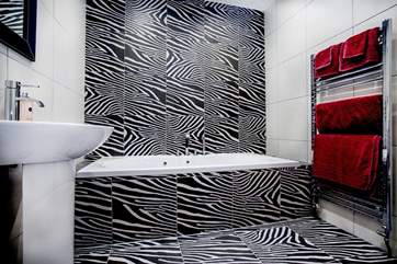 En suite to bedroom 2 has a rather striking design.