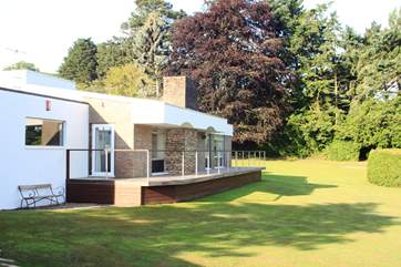 Looking across at the rear of the house and the tree-lined gardens beyond. So much space to relax and unwind.