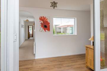 This large entrance hall awaits on the other side of the front door. Kick off your shoes, hang your coats up and prepare to have a wonderful holiday.