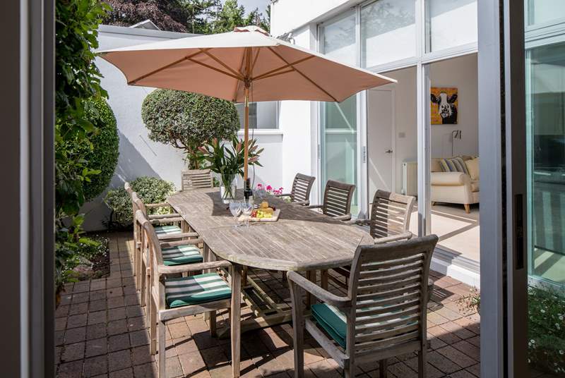 Dining al fresco in this superb internal courtyard is delightful, especially as you can still enjoy the waterside views.