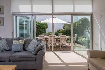 Step into the central outside dining area from both the dining-room and the living-area.