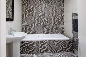 En-suite to bedroom two has a rather striking design.