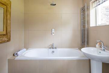 Bedroom one offers this great bath and shower. Perfect for relaxing in following a day of adventure and activity.