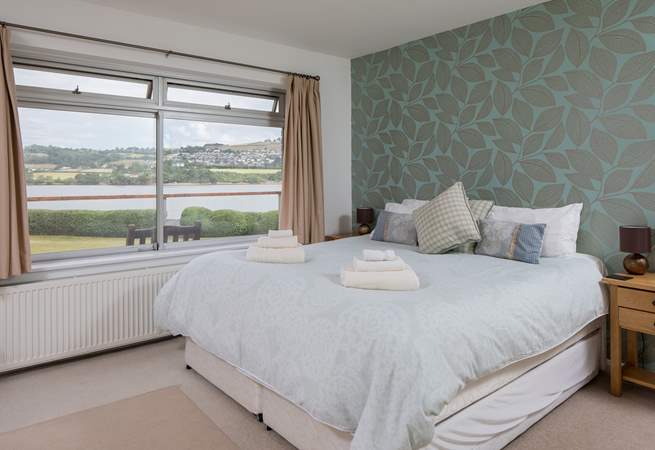 Bedroom one offers a fantastic space with water views and boasts a super-king sized bed.