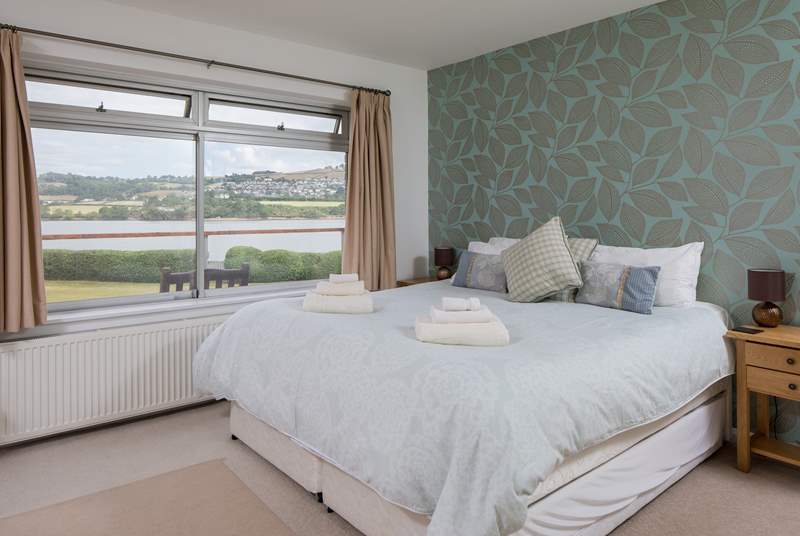 Bedroom one offers a fantastic space with water views and boasts a super-king sized bed.