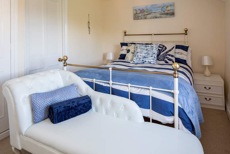 Soak up the sea views from the chaise longue in bedroom one.