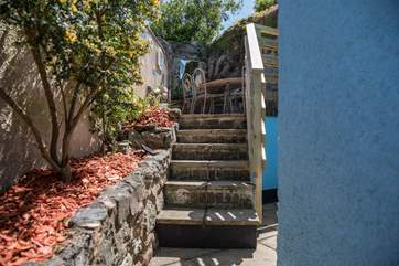The steps up to the patio table and chairs are supported by a hand-rail, however please do take care when ascending or descending.