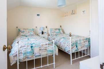 Bedroom two is home to these delightful single beds.