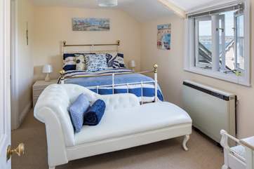 Bedroom one has a double bed, a gorgeous chaise longue and views towards the harbour.