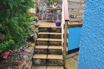 The steps up to the patio table and chairs are supported by a handrail, however, please do take care when ascending or descending.