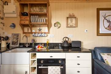 The kitchen is well-equipped and includes an electric oven and induction hob, perfect for rustling up a scrummy supper.