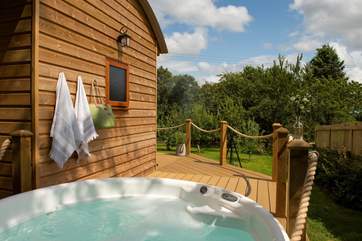 Tucked away in its own private orchard with a bubbling hot tub.