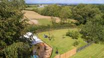 Sitting at the top of its own private orchard, there are 200 acres of ancient unspoilt woodland to explore just a stroll away down a green track.