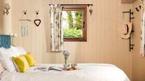 The sumptuous king size bed is perfect for a blissful sleep.