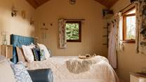 The sumptuous king-size bed promises a restful night's sleep. 