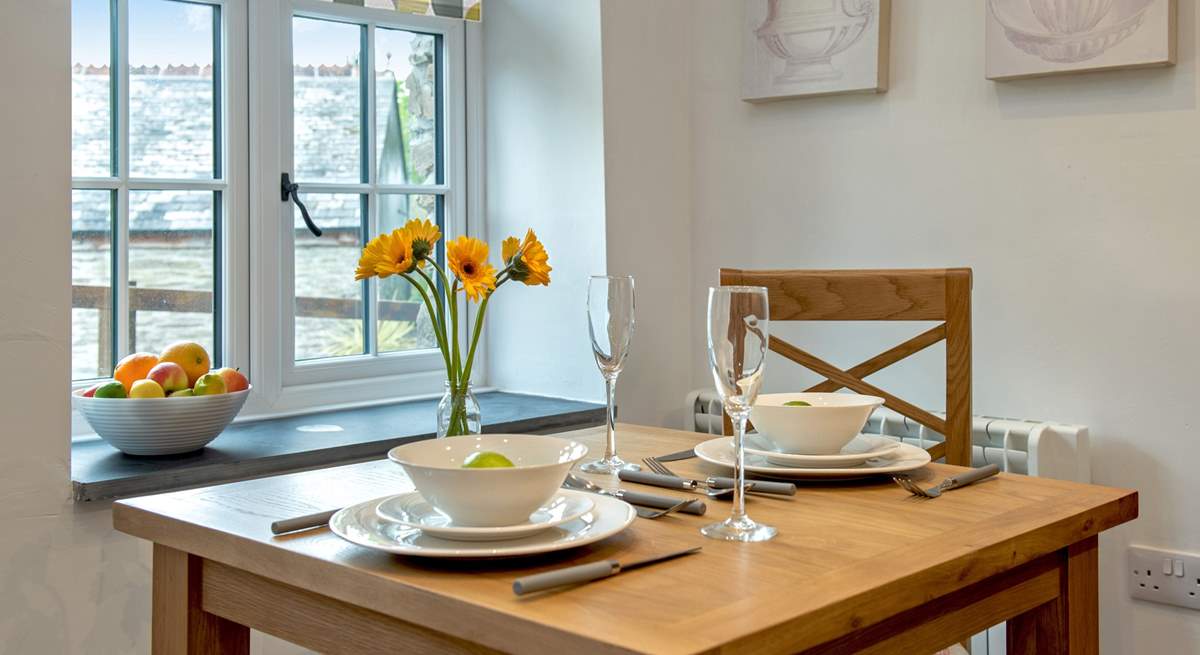 The dining-table looks out onto the courtyard.