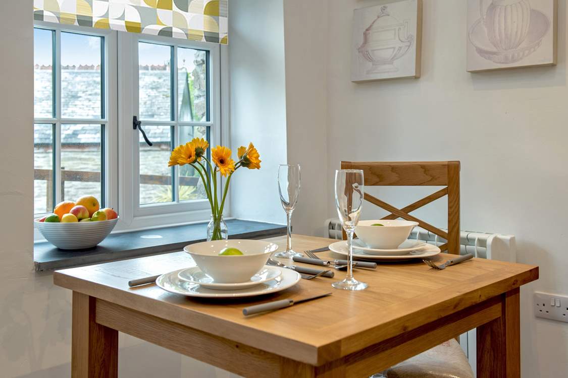 The dining-table looks out onto the courtyard.